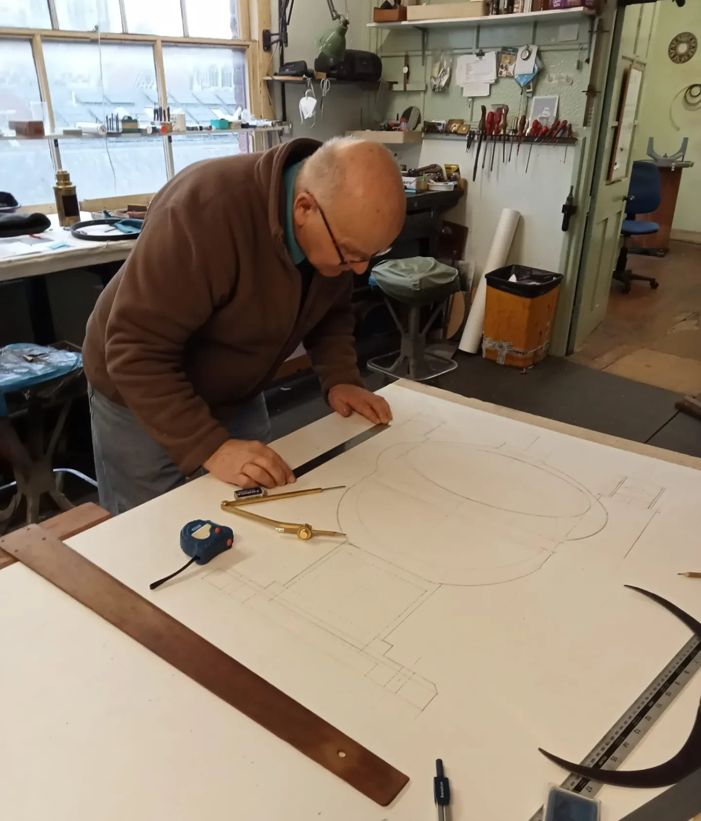 Brian Walker making drawings of the binnacle