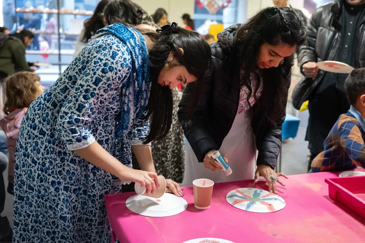 Two people take part in a crafting workshop
