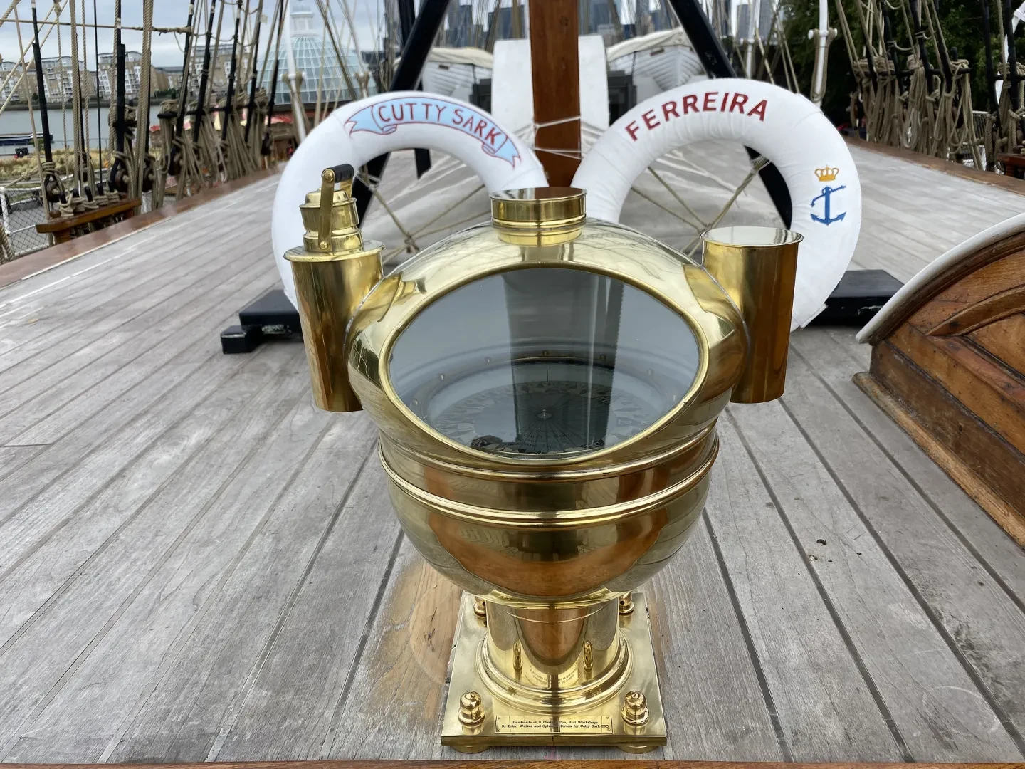 A brass binnacle fitted with two lamps sits on the poop deck of Cutty Sark