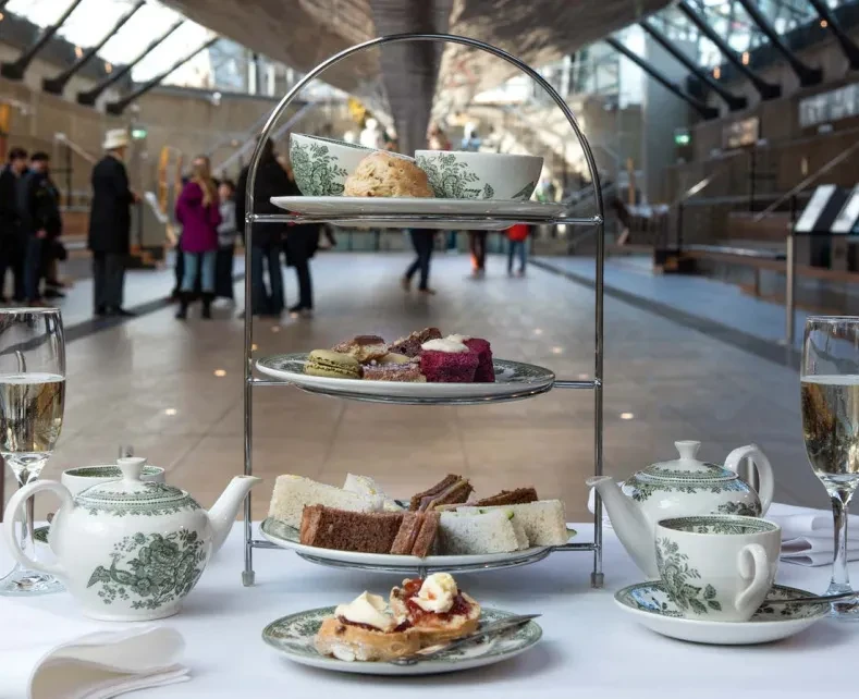 An afternoon tea table under the hull of Cutty Sark.