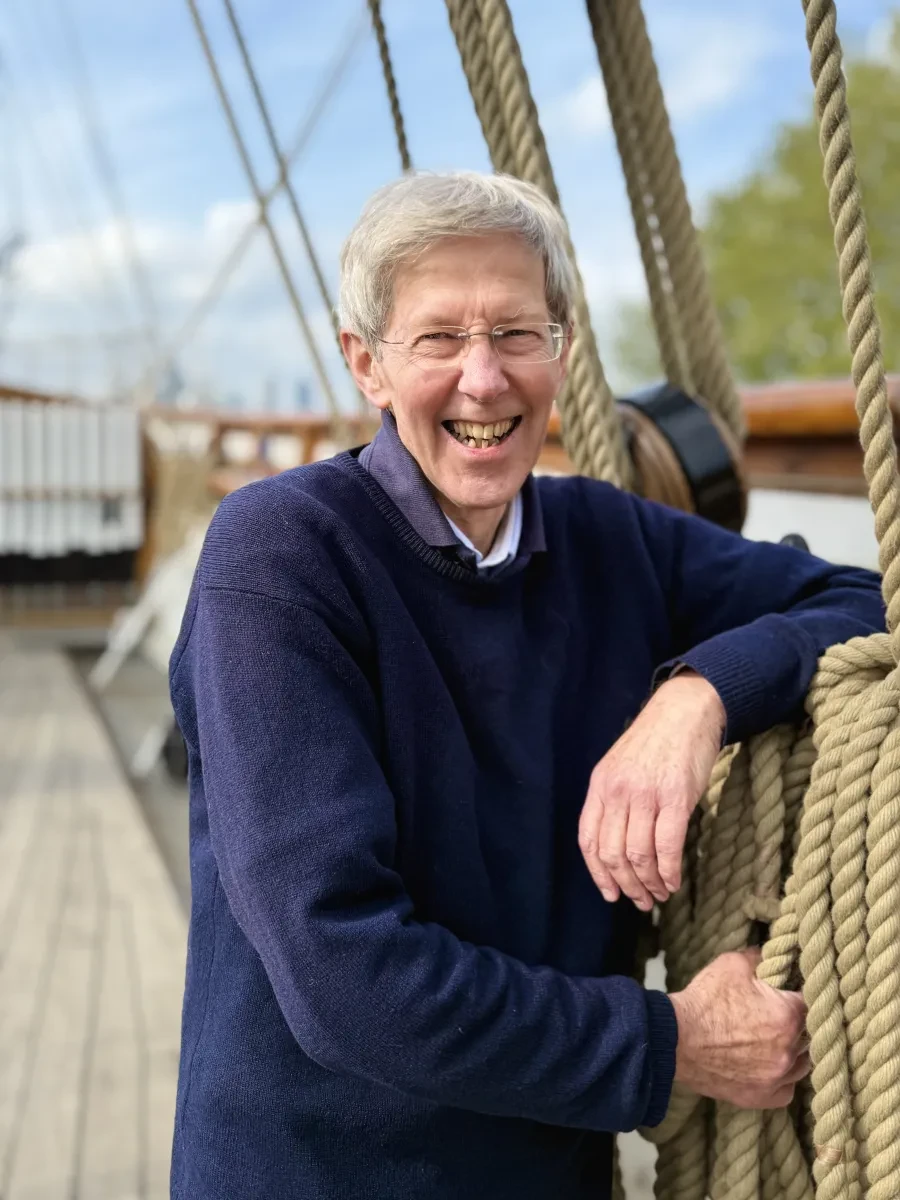 Photo of John Prescott smiling on Cutty Sark's deck next to rigging