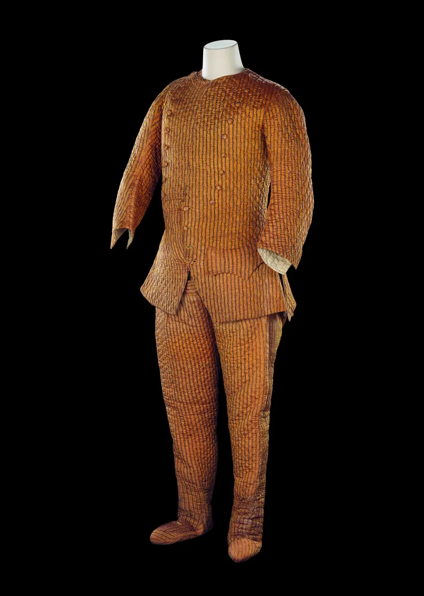 Photo of mannequin wearing lined brown padded suit