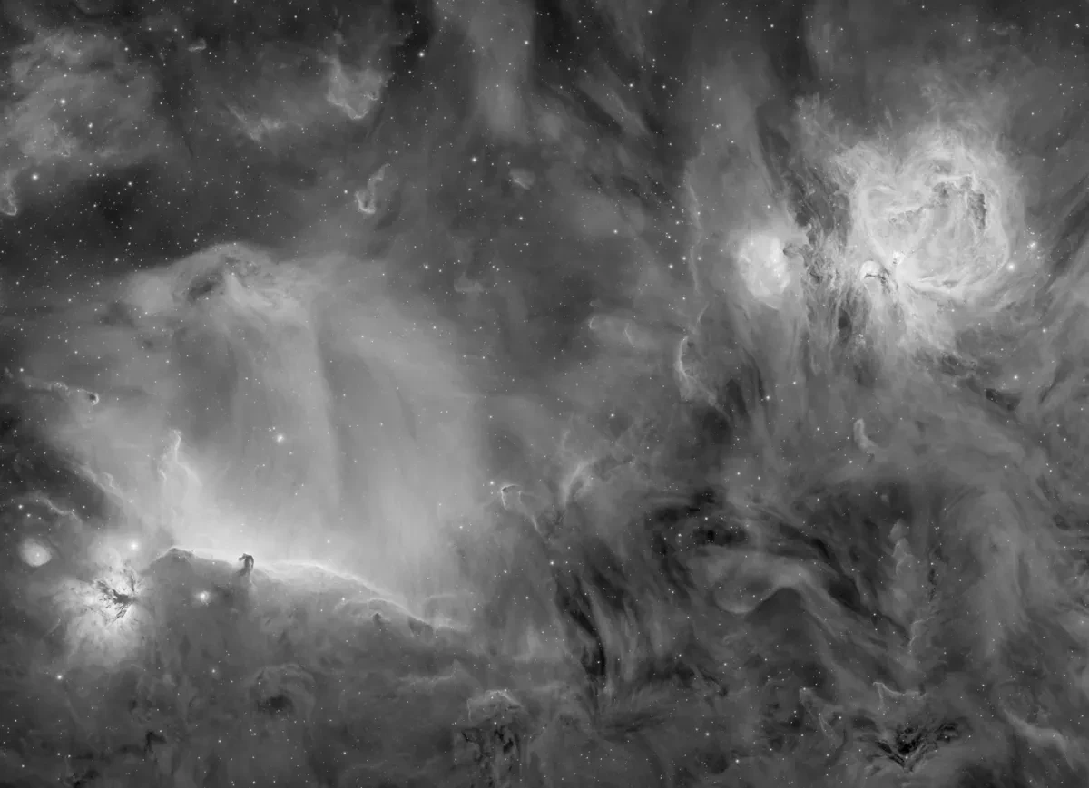 Black and white photograph of swirling gas clouds and nebula