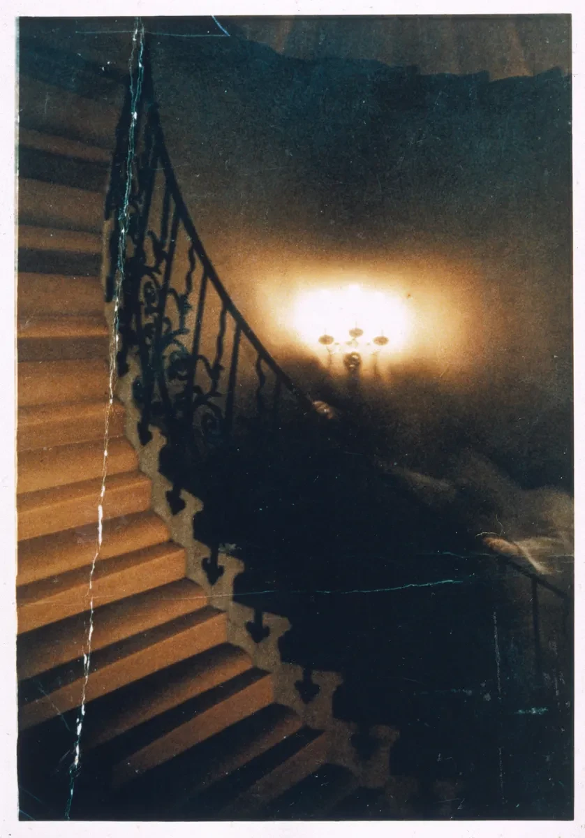 Historic photograph showing a ghostly figure ascending the spiral Tulip Stairs in the Queen's House