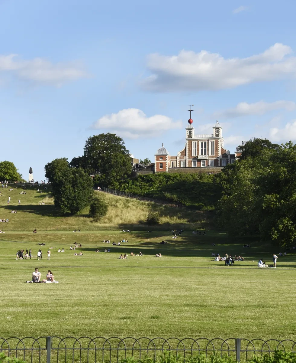 A view of Greenwich Park in summer, looking up the hill towards the Royal Observatory.