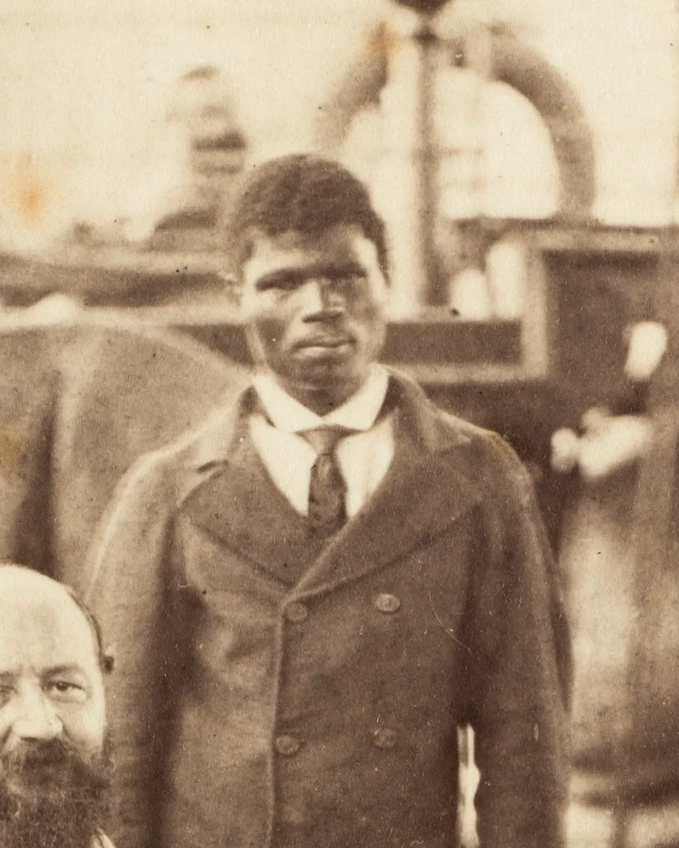 Historic photograph of a black man in double-breasted jacket and tie