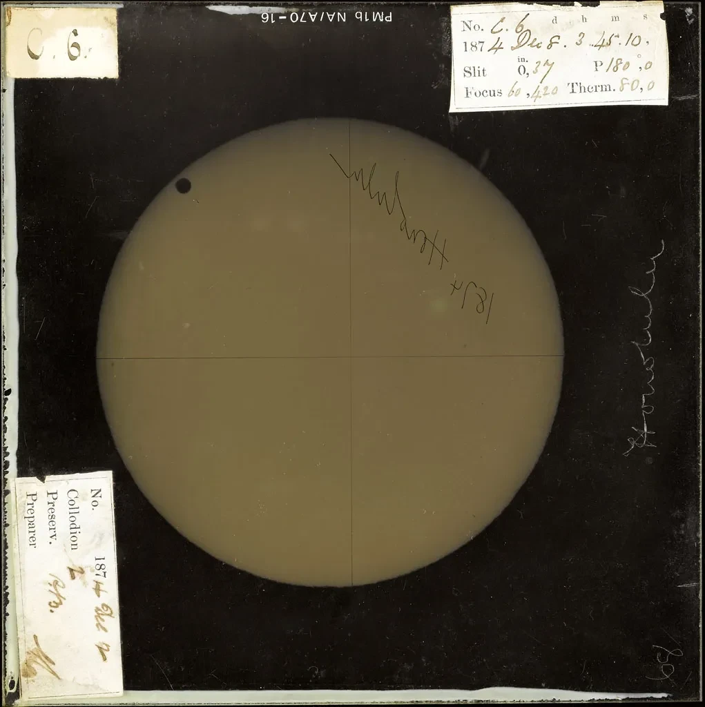 Positive image of Venus transiting the Sun's disk with handwritten notes stuck around the edges